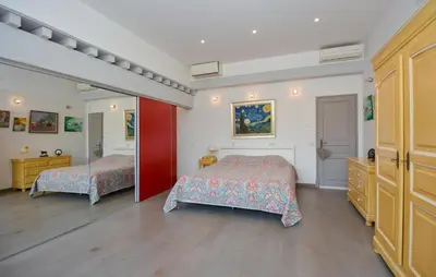 a bedroom with two beds and a mirror at Stunning Home In Noves With Wifi in Noves