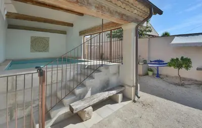 a house with a swimming pool and a balcony at Stunning Home In Noves With Wifi in Noves