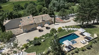 an aerial view of a house with a swimming pool at Domaine de la Lisière in Sault-de-Vaucluse