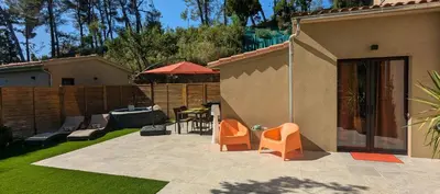 a backyard with a patio with chairs and a table at Studio climatisé - Terrasse, Plancha, Fibre in Aix-en-Provence