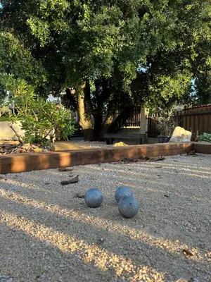 a swimming pool in a yard with a wooden deck at Villa Saint Martin in Malemort-du-Comtat