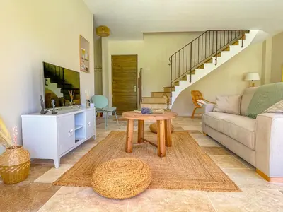 a living room with a couch and a table at Villa Mathilde, un meublé de tourisme 3 étoiles au cœur de Goult in Goult