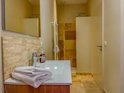 a bathroom with a sink and a shower at Villa Mathilde, un meublé de tourisme 3 étoiles au cœur de Goult in Goult