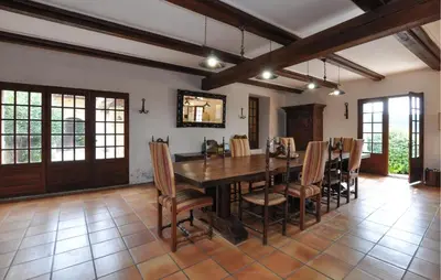 a dining room with a wooden table and chairs at Stunning Home In Vacheres in Vachères