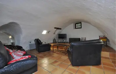 a living room with couches and a table at Stunning Home In Vacheres in Vachères
