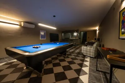 a living room with a pool table in a room at Mas Naste in Eygalières