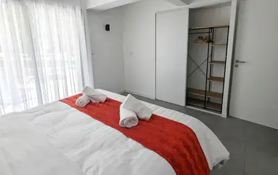 a bedroom with a bed with towels on it at Évasion Moderne en Provence in Lambesc