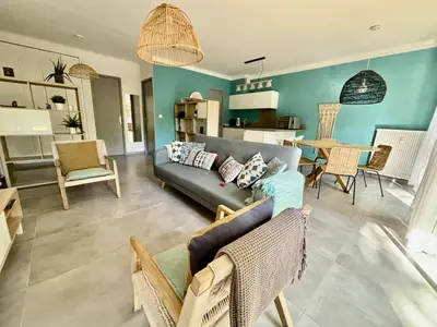 a living room with a couch and a table at Magnifique T2 avec Terrasse in Aix-en-Provence