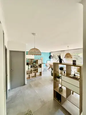 a living room with a kitchen and a dining room at Magnifique T2 avec Terrasse in Aix-en-Provence