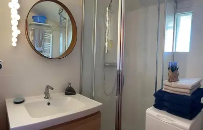 a bathroom with a sink and a shower and a mirror at Hypercenter lovely duplex with Terrace CLIM WIFI in Aix-en-Provence