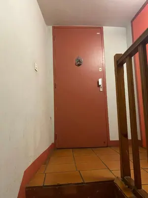 a brown door in a room with a tile floor at Hypercenter lovely duplex with Terrace CLIM WIFI in Aix-en-Provence