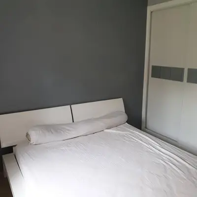 a bedroom with a white bed and a window at Appartement dans campagne aixoise in Ventabren