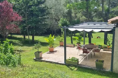 a swimming pool with lounge chairs and a playground at Appartement dans campagne aixoise in Ventabren