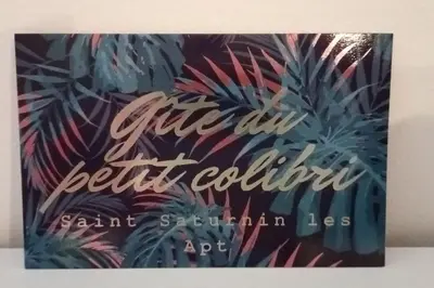 a book cover of a book with palm trees at maisonnette provençale piscine le petit colibri in Les Cordiers