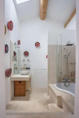 a white bathroom with a tub and a sink at Superbe Mas provençal, entre Gordes et Roussillon in Murs