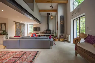 a living room with two couches and a fireplace at Superbe Mas provençal, entre Gordes et Roussillon in Murs