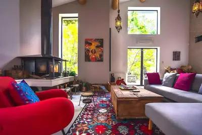 a living room with a couch and a fireplace at Superbe Mas provençal, entre Gordes et Roussillon in Murs