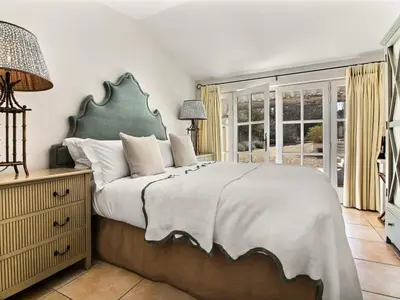 a bedroom with a large bed and a window at Les Blayons - Exclusive Pool Villa Stunning View in Bonnieux