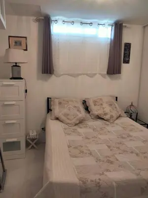 a bedroom with a large bed and a window at Nature in Cabrières-dʼAigues