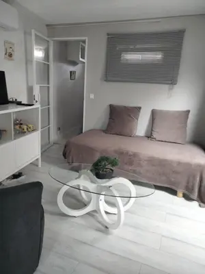 a room with a bed and a glass table at Nature in Cabrières-dʼAigues