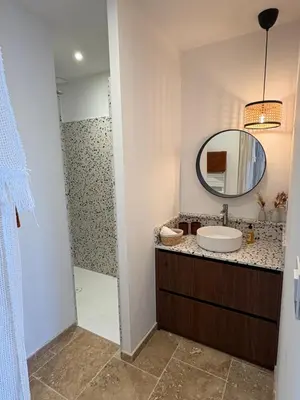 a bathroom with a sink and a mirror at Le petit Auzon in Mazan