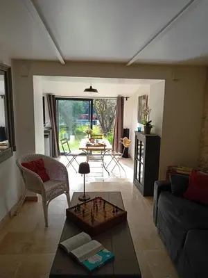 a living room with a couch and a table at Le Souliadou in Saint-Didier