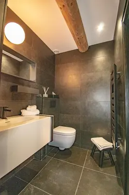 a bathroom with a toilet and a sink and a tub at Le Baudelaire - magnifique appartement au cœur du centre historique in Aix-en-Provence