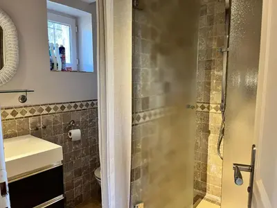 a bathroom with a sink and a shower at Studio at Mas Naste in Eygalières