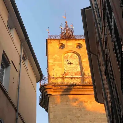 a tall building with a clock tower in the distance at Appartement vue superbe 70m2 2Balcons 2Chambres VRAI CLIMATISATION in Aix-en-Provence