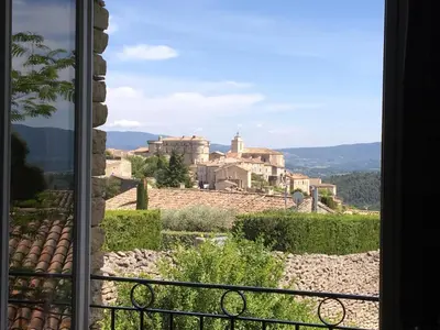 a view of a village from a window at Le balcon de Gordes in Gordes