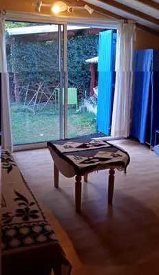 a room with a table in front of a window at La restanque in La Tour-dʼAigues