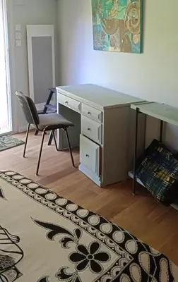 an office with a desk and a chair and a desk at La restanque in La Tour-dʼAigues