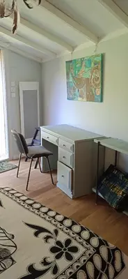 an office with a desk and a chair in a room at La restanque in La Tour-dʼAigues