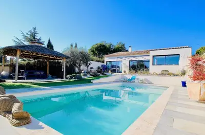 a swimming pool in front of a house at Villa aloha in Saint-Rémy-de-Provence