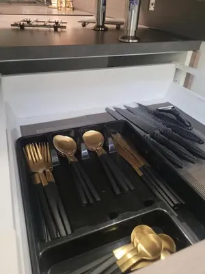 an open drawer in a kitchen with utensils at Appartement Au cœur de l'Isle in LʼIsle-sur-la-Sorgue