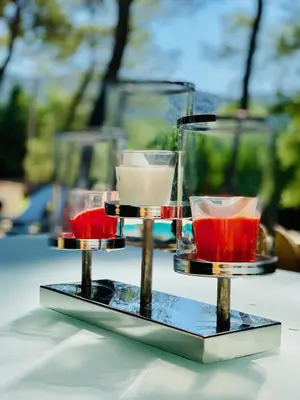 a three tiered tray with three different colored drinks at Zen et Chic, juste à coté de la Bastide de Marie in Ménerbes
