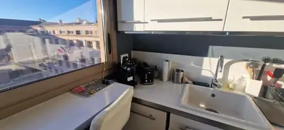 a kitchen counter with a sink and a window at Le Ciel Bleu Clim Wifi Garage in Aix-en-Provence