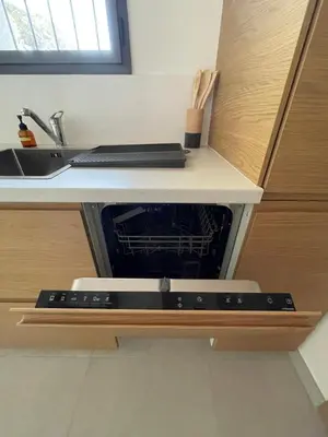 a dishwasher in a kitchen with a sink at STUDIO campagne Les Clapiers AIX EN PROVENCE in Aix-en-Provence