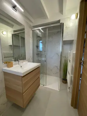 a bathroom with a sink and a glass shower at STUDIO campagne Les Clapiers AIX EN PROVENCE in Aix-en-Provence