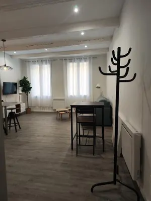 a room with a table and a cross on the wall at Bon Pasteur in Aix-en-Provence