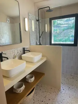 a bathroom with a sink and a mirror at La canopée, Bastide sur les hauteurs de Lourmarin in Lourmarin