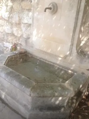 a stone bath tub in a stone building at Gite au coeur de la Provence & SPA in Saint-Cannat
