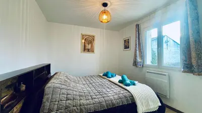 a bedroom with a bed with two teddy bears on it at Rendez-vous en Provence -10 personnes- duo de gîtes- piscine privée - clim in Cheval-Blanc