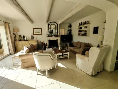 a living room with a couch and chairs and a table at La bastide le Jucamas in Saint-Saturnin-les-Apt