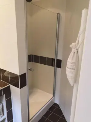 a shower with a glass door in a bathroom at La bastide le Jucamas in Saint-Saturnin-les-Apt
