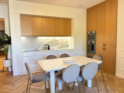 a kitchen with a table and chairs in a room at Le Pénélope in Aix-en-Provence