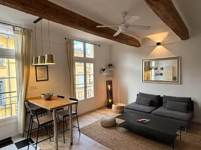 a living room with a couch and a table at Le Prêcheur in Aix-en-Provence