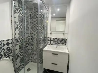 a bathroom with a sink and a glass shower at Le Prêcheur in Aix-en-Provence