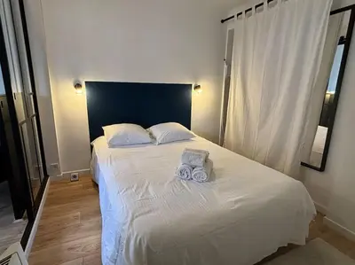 a bedroom with a bed with two towels on it at Le Prêcheur in Aix-en-Provence