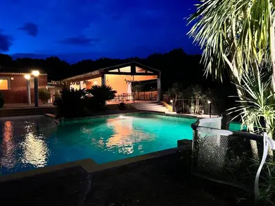 a swimming pool in a backyard at night at Studio Estrella - Studio 2 personnes - Domaine Astra, Grans in Grans